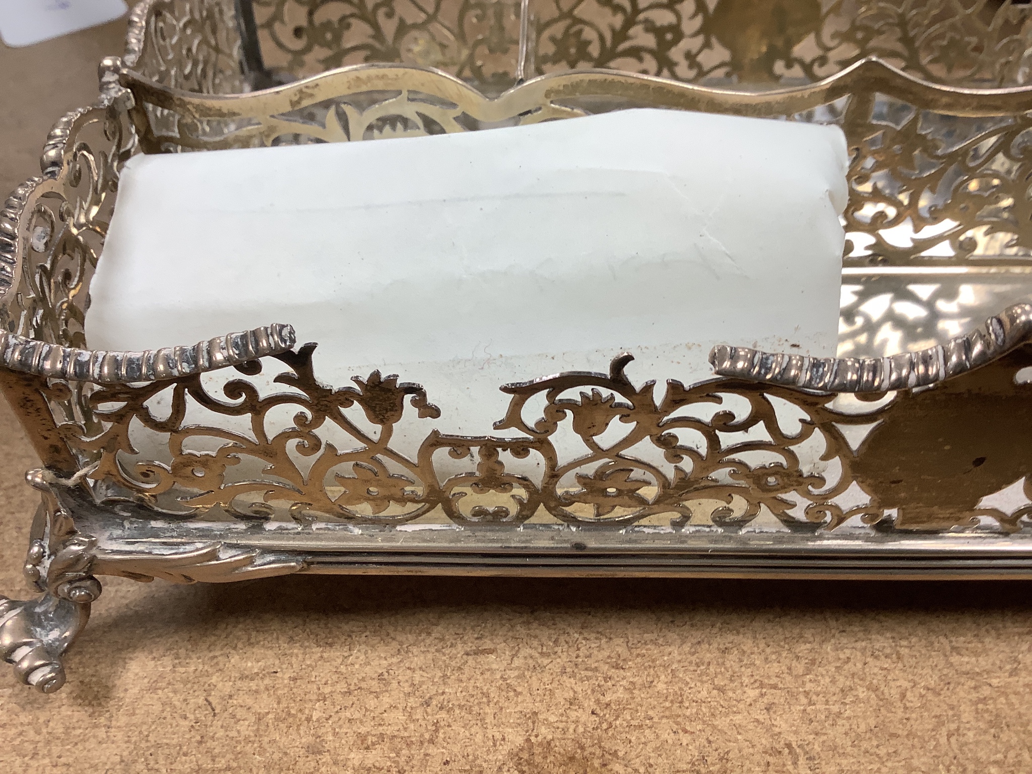 A late Victorian pierced silver twin inkstand, with two mounted glass inkwells, (a.f.), London, 1884, 25.3cm, 18.5oz.